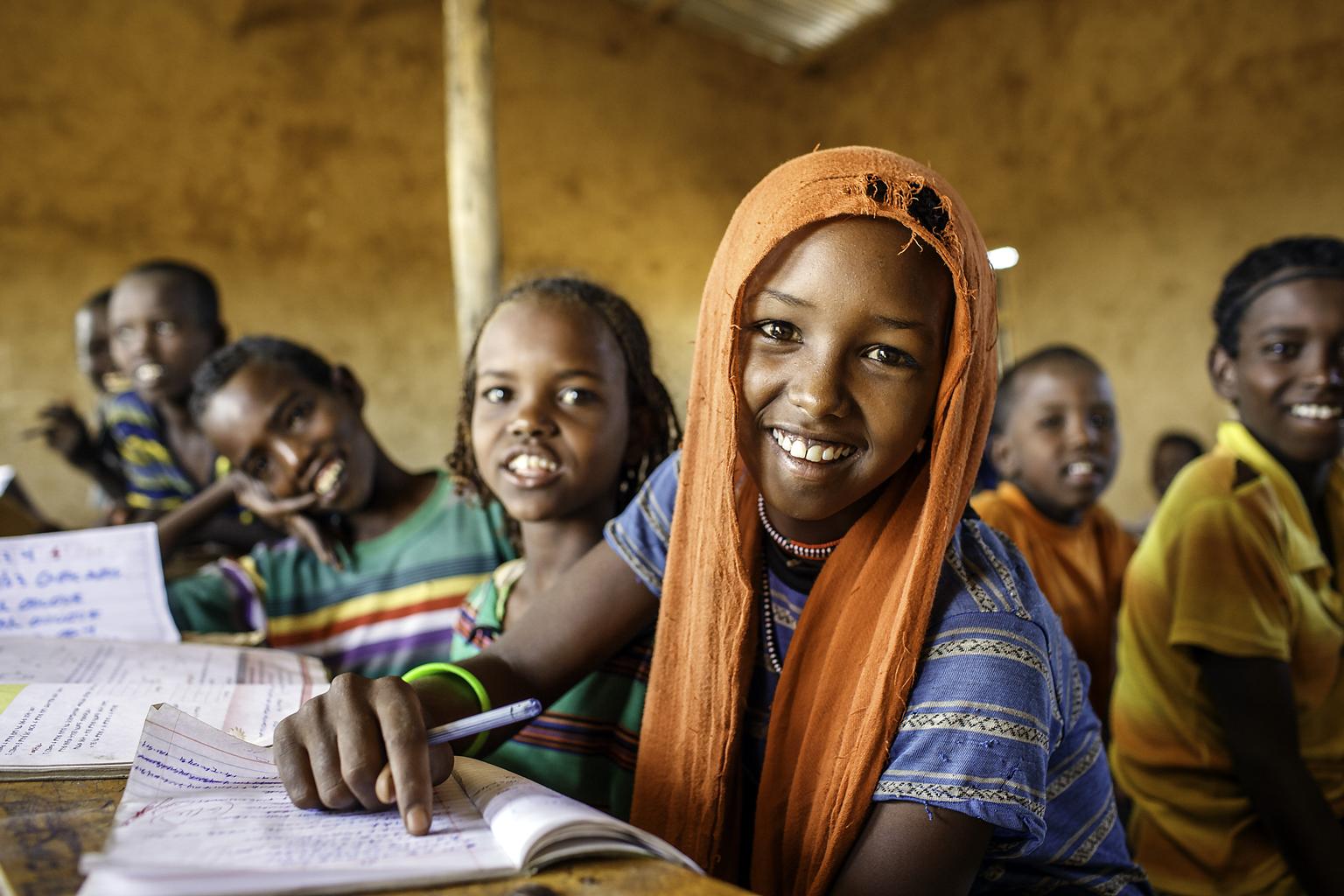 [PHOTO shows chidden attending school in Ethiopia. PHOTO CREDIT: UNICEF]