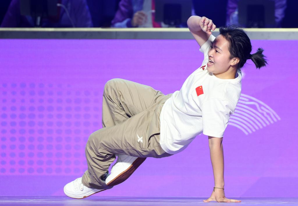 PHOTO shows Breakdancer Liu Qingyi of China competing during the women's gold medal battle of breaking at the 19th Asian Games in Hangzhou, east China's Zhejiang Province on Oct. 7, 2023 - Xinhua