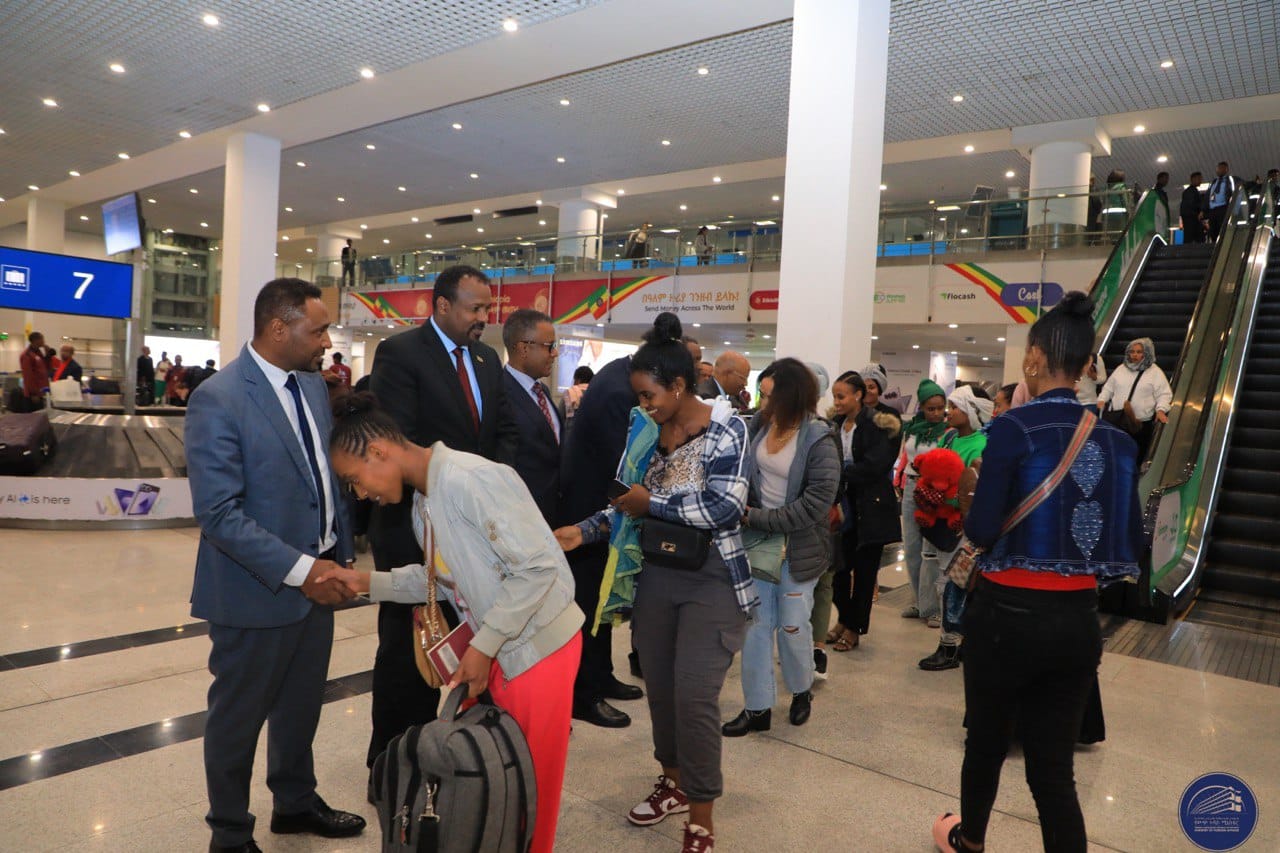 (MOFA photo shows Ethiopian returnees at Bole International Airport in Addis Ababa.)